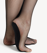 Black fishnet stockings worn by a person on a white background
