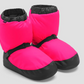 Pink and black booties on a light gray background