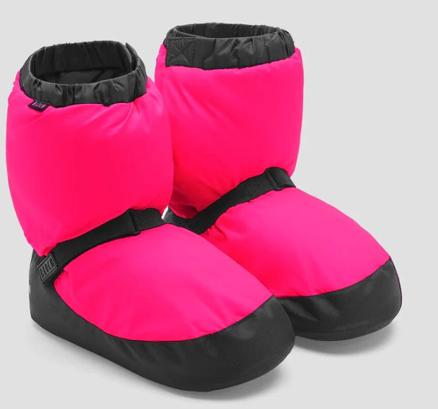 Pink and black booties on a light gray background