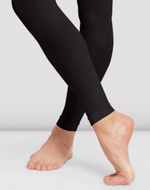 Black leggings worn by a person on a light gray background