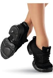 A pair of black mesh sneakers with a distinctive sole design, intended for adult dancers.